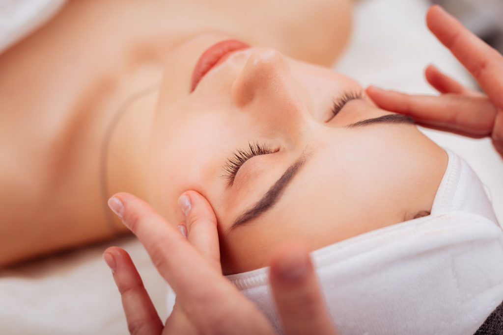 Close-up of a woman resting during a facial skin treatment